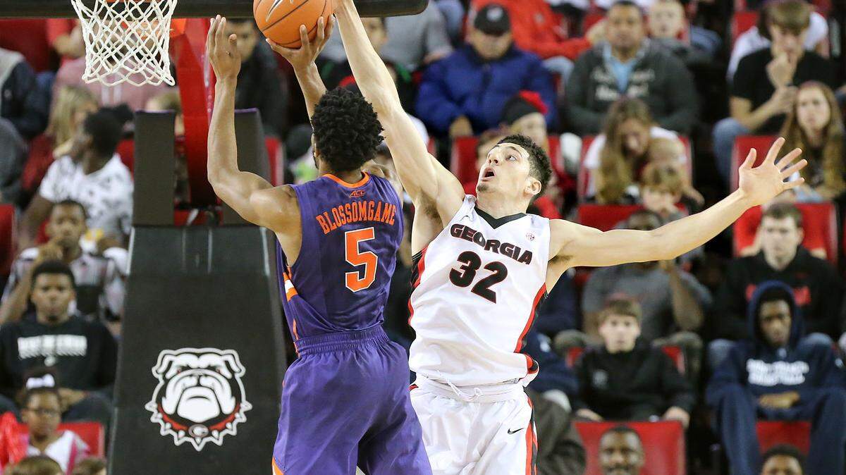 Georgia forward Mike Edwards blocks a shot by Clemson forward Jaron Blossomgame during Tuesday's game in Athens.