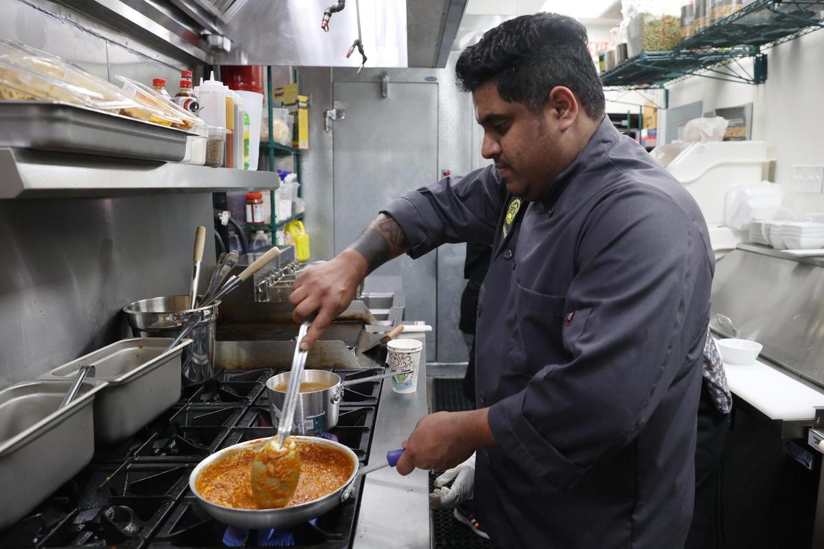 Chef Prasad Naik cooks vegetable curry dish pav bhaji in the kitchen of Cook-in-Pot on Forsyth Street on Tuesday, Feb. 4, 2025, in downtown Macon, Georgia. The new restaurant offers a wide variety of authentic Indian, Mediterranean and Indo-Chinese dishes.