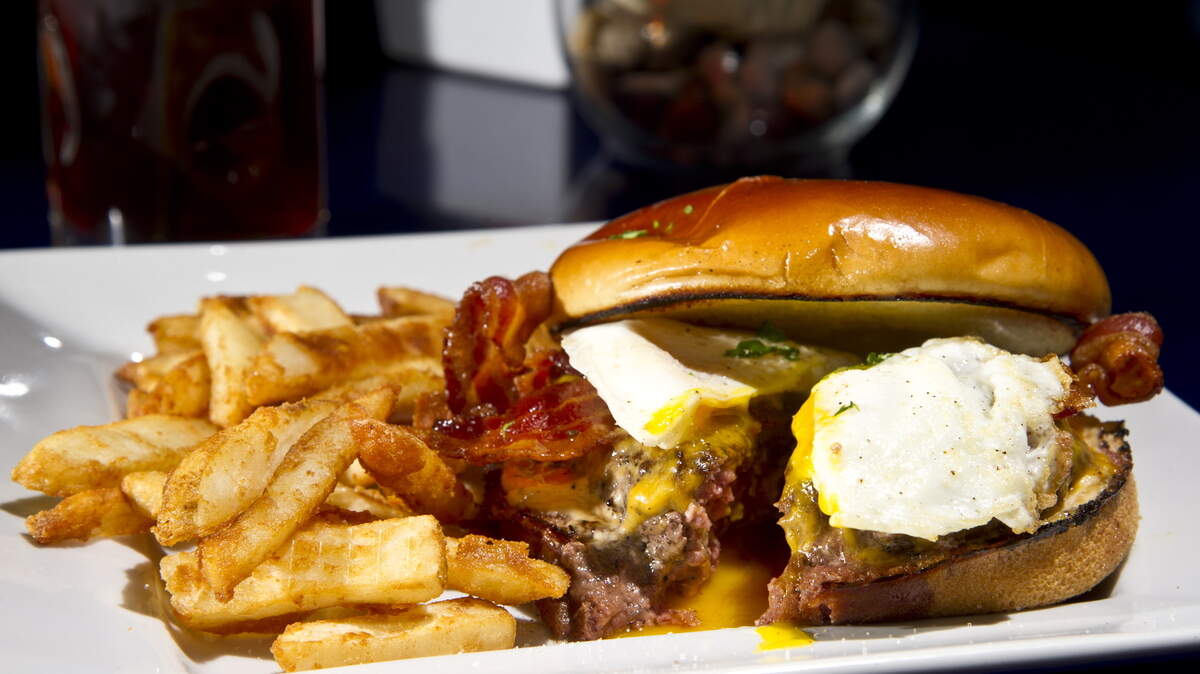 WOODY MARSHALL/THE TELEGRAPHEdgar's Bistro serves the breakfast burger on its lunch menu. It's a cheddar cheeseburger with bacon and a fried egg.