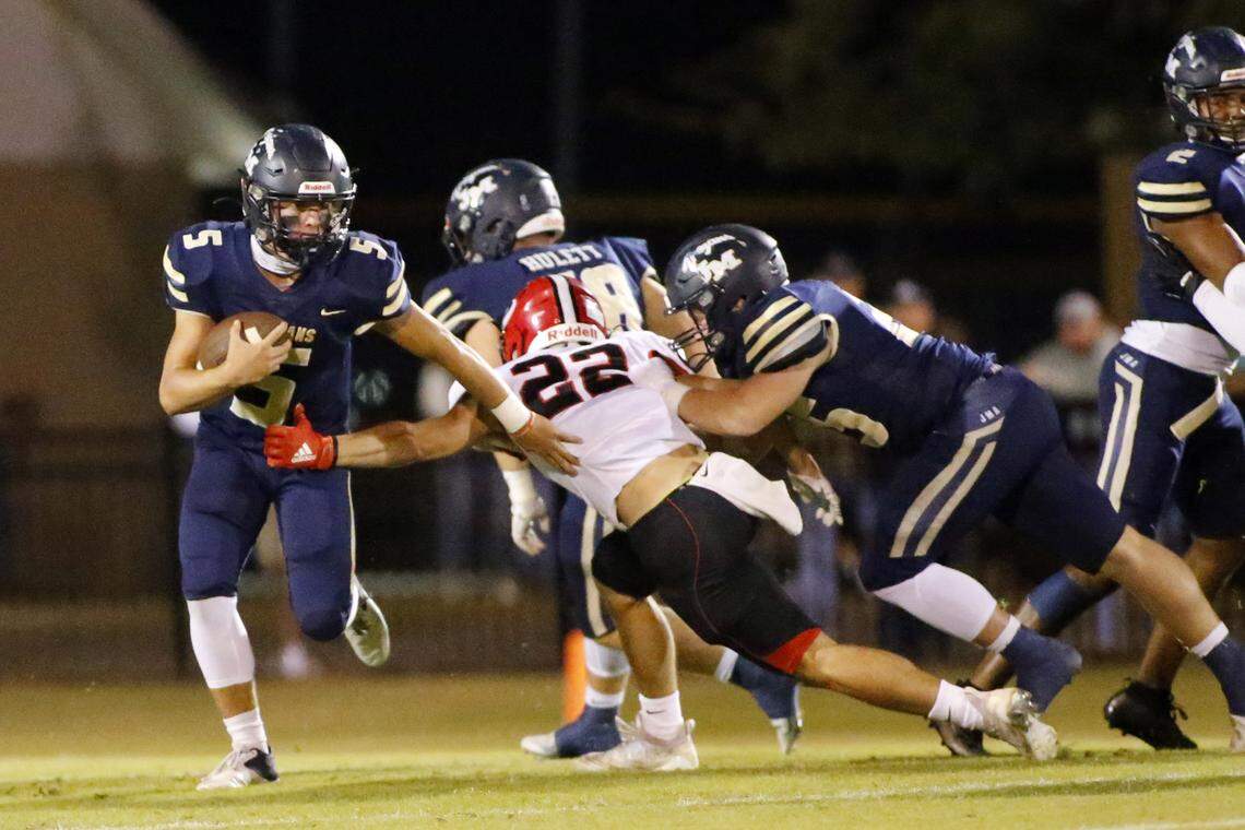 John Milledge’s Briggs Eady (5) eludes FPD’s tackler # 22 Griffin Green (22) during their game Friday night.