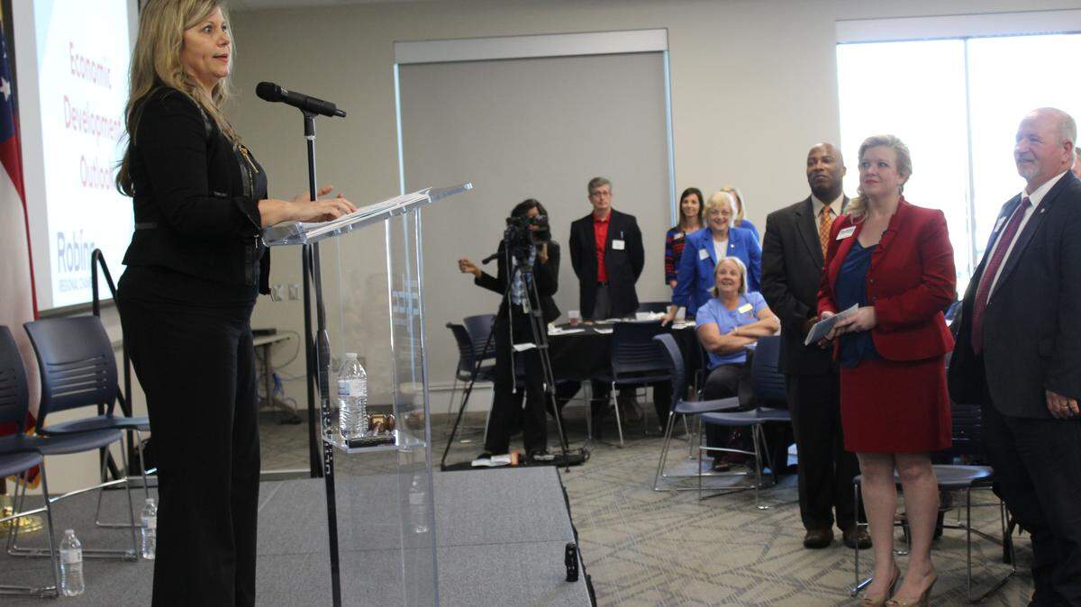 WAYNE CRENSHAW/THE TELEGRAPH 
 Angie Gheesling, executive director of the Houston County Development Authority, asks members of the audience to stand as she names different groups that were part of luring Sandler AG to Houston County.
