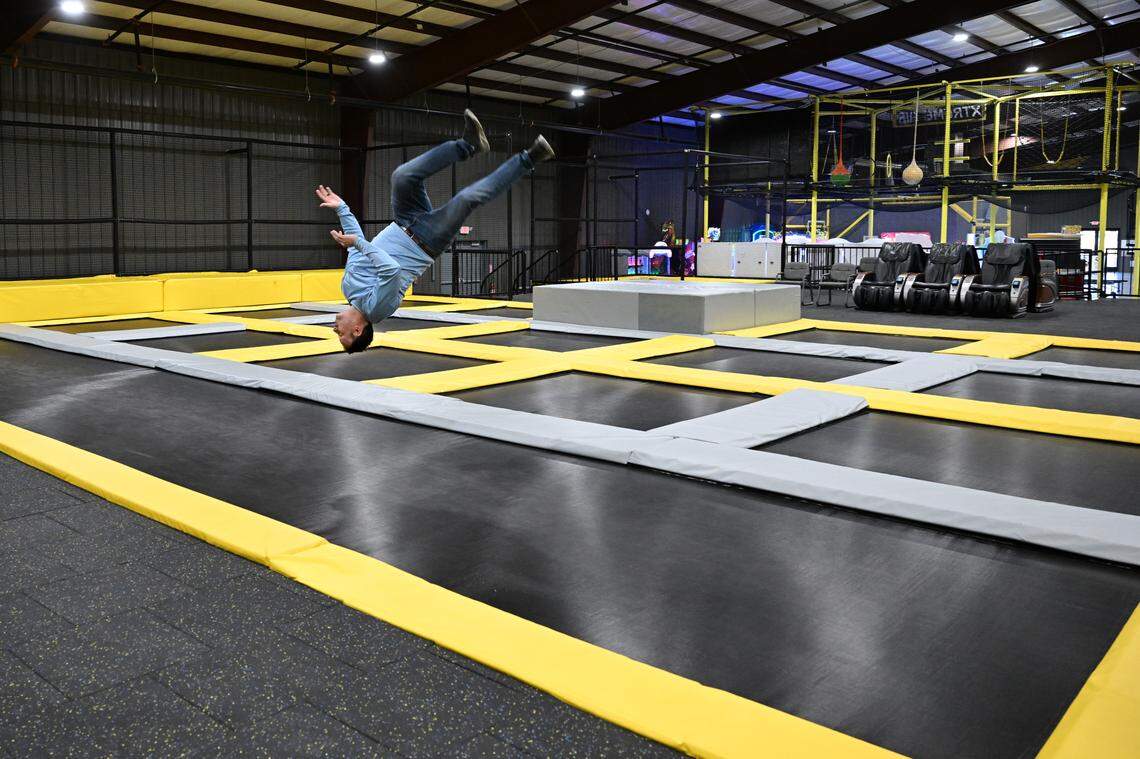 Co-owner Todd Buckelew flips across the trampoline main court inside of Xtreme Air Mega Park in Warner Robins.