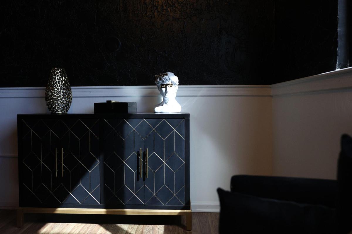 Decorations sit on a cabinet in “The Good Life” private party room at Bon Vivant Restaurant and Lounge on Thursday, Oct. 17, 2024, in Warner Robins, Georgia. Bon Vivant opened Thursday and aims to bring upscale dining to downtown Warner Robins.