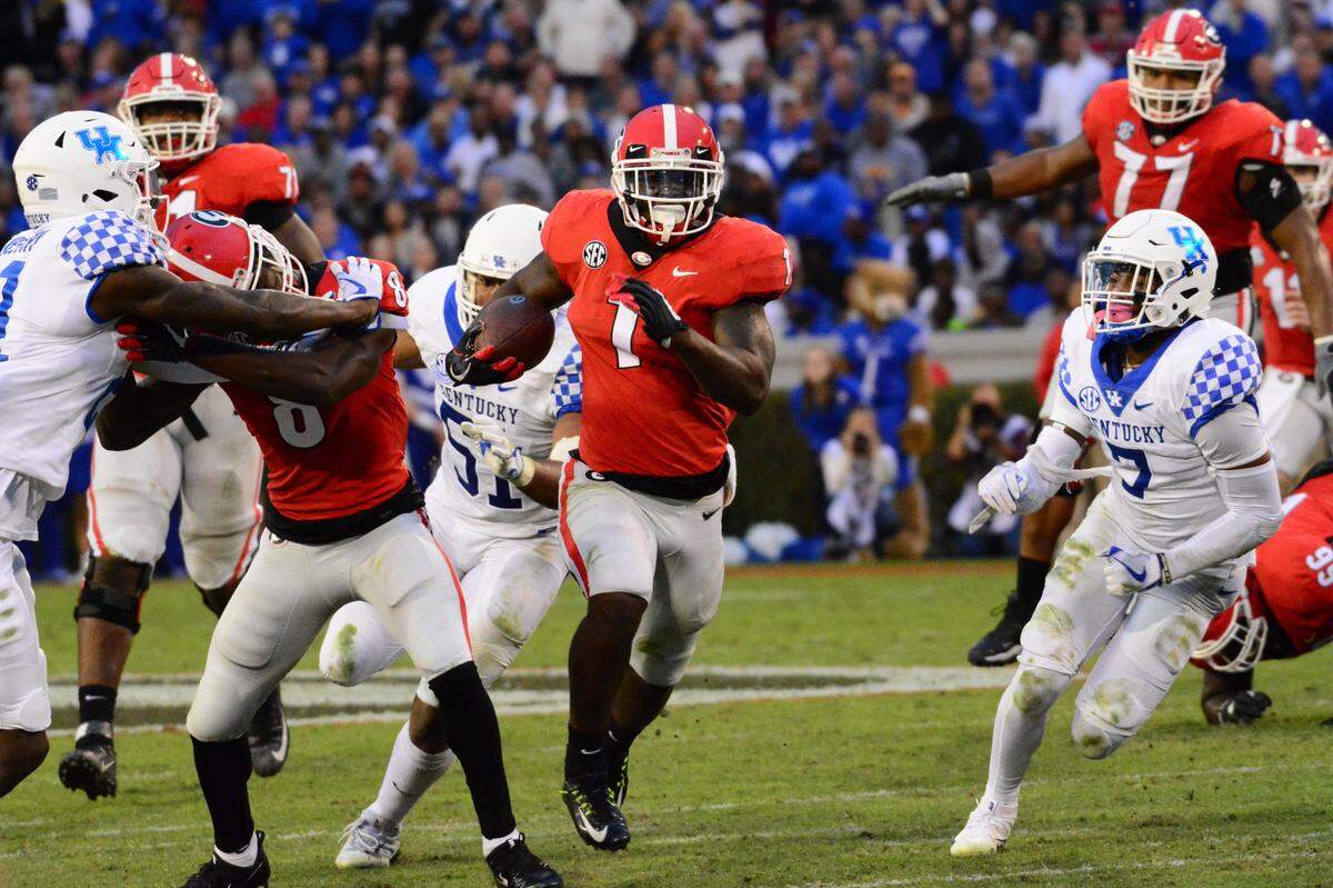 Running back Sony Michel hits the gap in this Telegraph file photo. Michel will play for the Rams in Sunday’s Super Bowl.