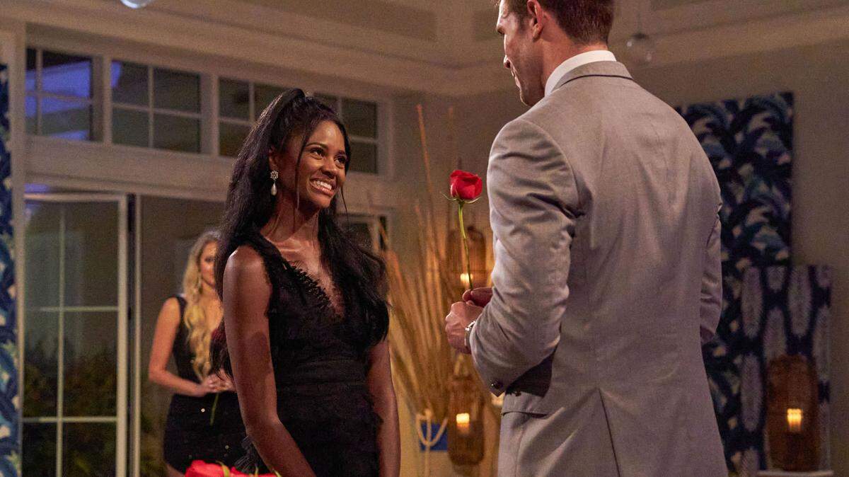 THE BACHELOR - Charity Lawson, a Columbus, GA woman, accepts Zach’s rose.