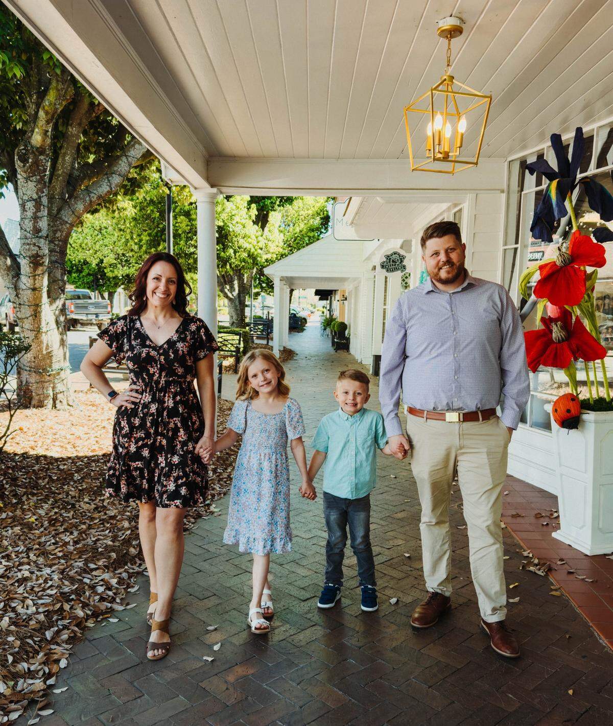 The Collins family take a stroll in downtown Perry. From left to right, Afton, 8-year-old Arianna, 5-year-old Jacob and Justin.
