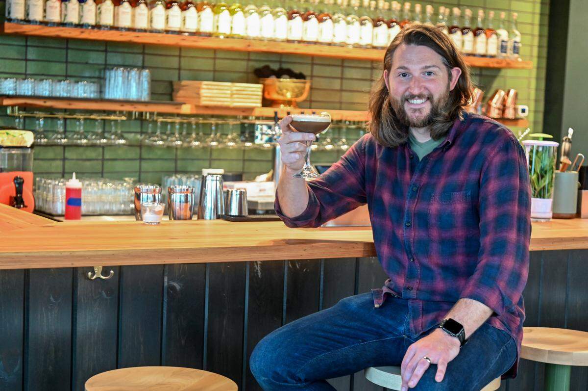 Co-owner Will Robinson raises a Cafe Romano house cocktail at Longleaf Distillery at 664 Second St. in downtown Macon.