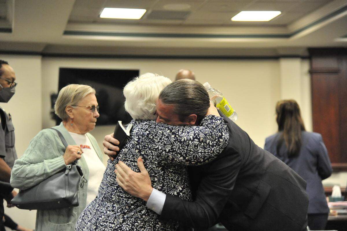 Marcus Lillard, right, hugs his mother, Elsie Lillard, before opening arguments in Marcus Lillard’s murder trial in Baldwin County Superior Court. Marcus Lillard is accused of felony murder, aggravated assault and involuntary manslaughter in the May 2019 strangulation death of University of Georgia professor Marianne Shockley.