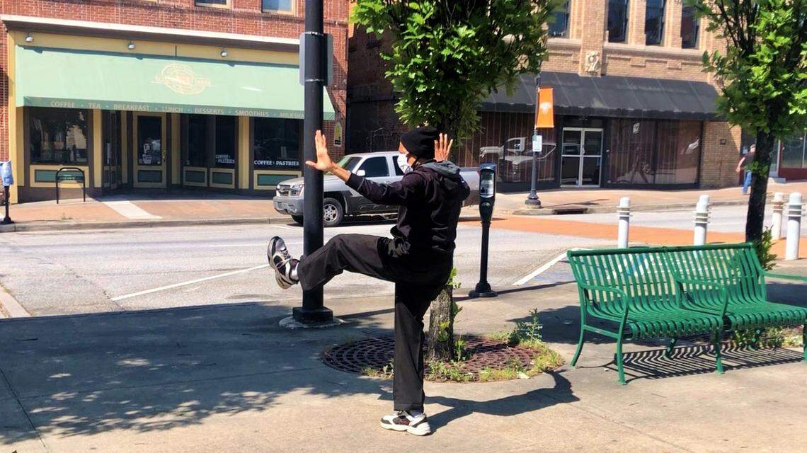 As Macon copes with the coronavirus pandemic, a man this week in a surgical mask was doing what appeared to be tai chi in a park along Poplar Street in downtown.