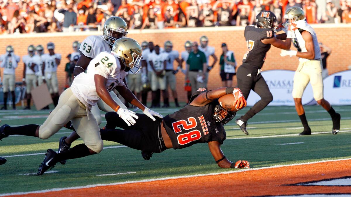 Mercer running back Tee Mitchell stretches for a touchdown during Saturday’s game against Jacksonville.
