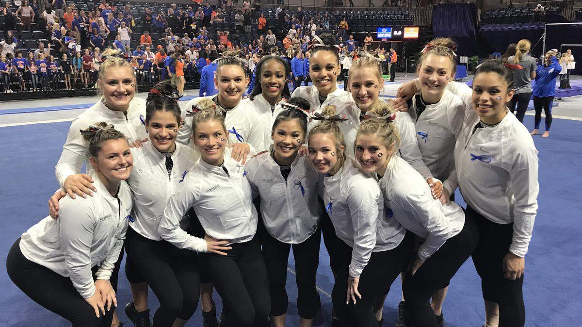 GymDogs celebrate a 197.450-197.375 win over Florida at the Stephen O’Connell Center. Georgia beat its rival for the first time since 2008.