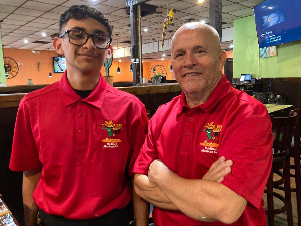 Jesus Hernandez, right, one of the owners of Medina’s Mexican Grill in Warner Robins, with his 15-year-old son, Daniel Hernandez.&nbsp;