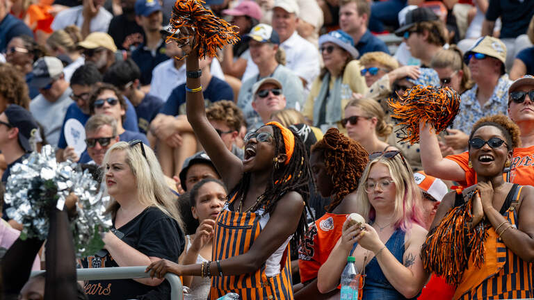 Amid a sea of Georgia Tech colors, some Mercer orange shines through in Atlanta