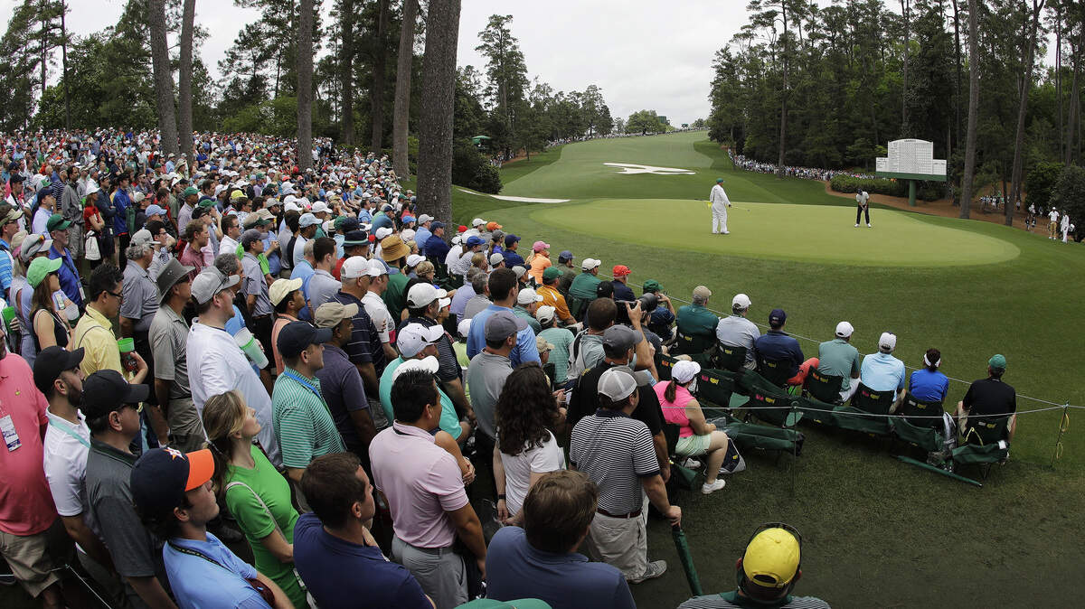 Francesco Molinari, of Italy, putts on the 10th hole during the final round for the Masters golf tournament, Sunday, April 14, 2019, in Augusta, Ga. (AP Photo/Charlie Riedel)