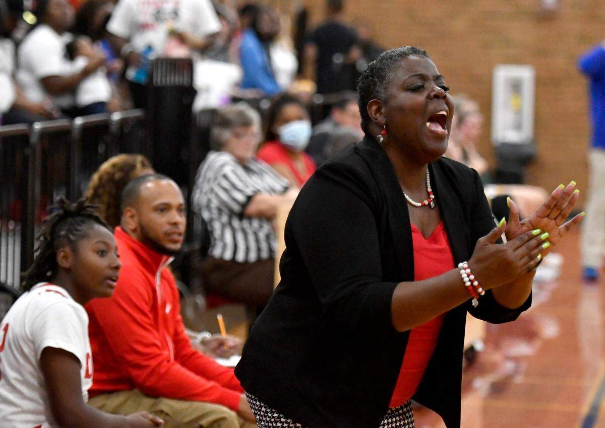 Dodge County head coach Casandra Hamilton cheers on her team during the Indians’ 71-26 win over ACE in the first round of the GHSA playoffs Wednesday.