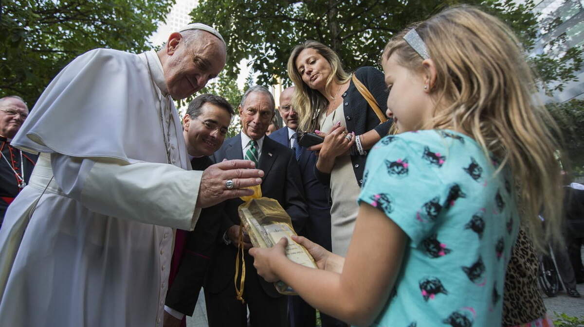 Pope Francis is given a gift from a child while visiting New York in September. A publishing house is working on a book of the pontiff's personal responses to 30 hand-written letters and drawings solicited from children ages 6 to 13.