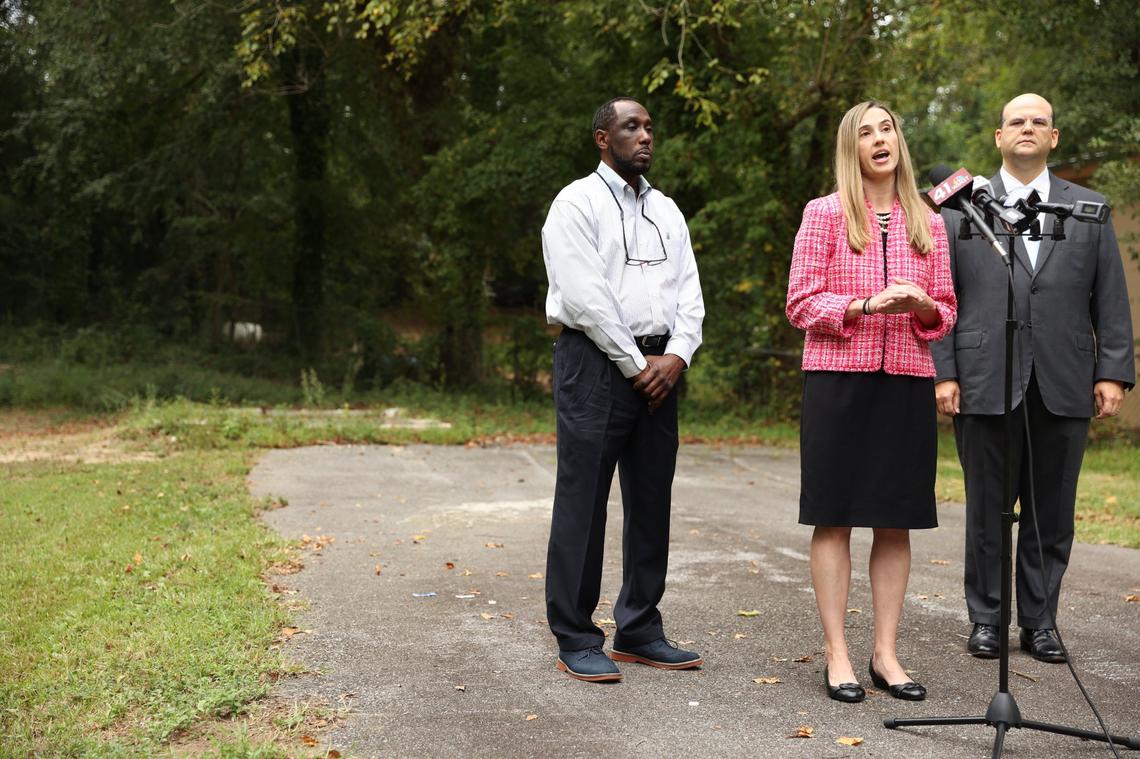 From left to right: Home owner Eric Arnold, Institute for Justice attorney Christie Hebert and attorney Devlin Cooper of Cooper, Barton and Cooper give a press conference on Arnold’s property on Wednesday, Sept. 18, 2024, off of Sunnyvale Drive in Macon, Georgia. Arnold bought the property with the intent of fixing up the house on it for his family, but the house was torn down by Macon-Bibb County. Arnold and his legal counsel have now filed a lawsuit against Macon-Bibb County in state court.