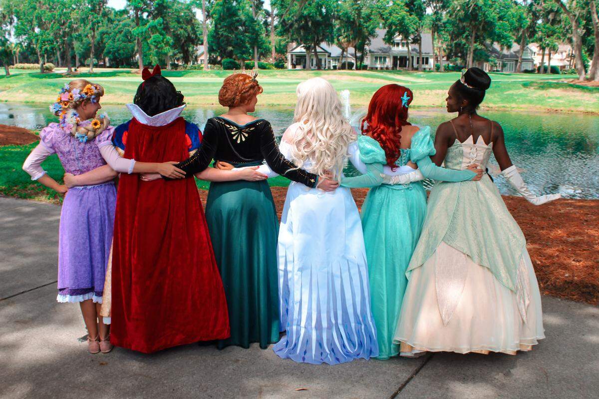 Dream A Little Wish Entertainment princesses by a lake in Savannah, Ga., prior to an event. The business offers a wide variety of characters for performance entertainment and larger-than-life fun.