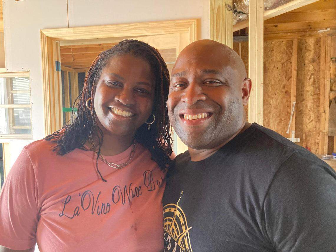 Ebony Lewis, left, with the help of her husband, Marc, is opening La’Vino Wine Bar at 106 South Kimberly Road in Warner Robins. They’re standing inside the building, which is now undergoing a transformation.