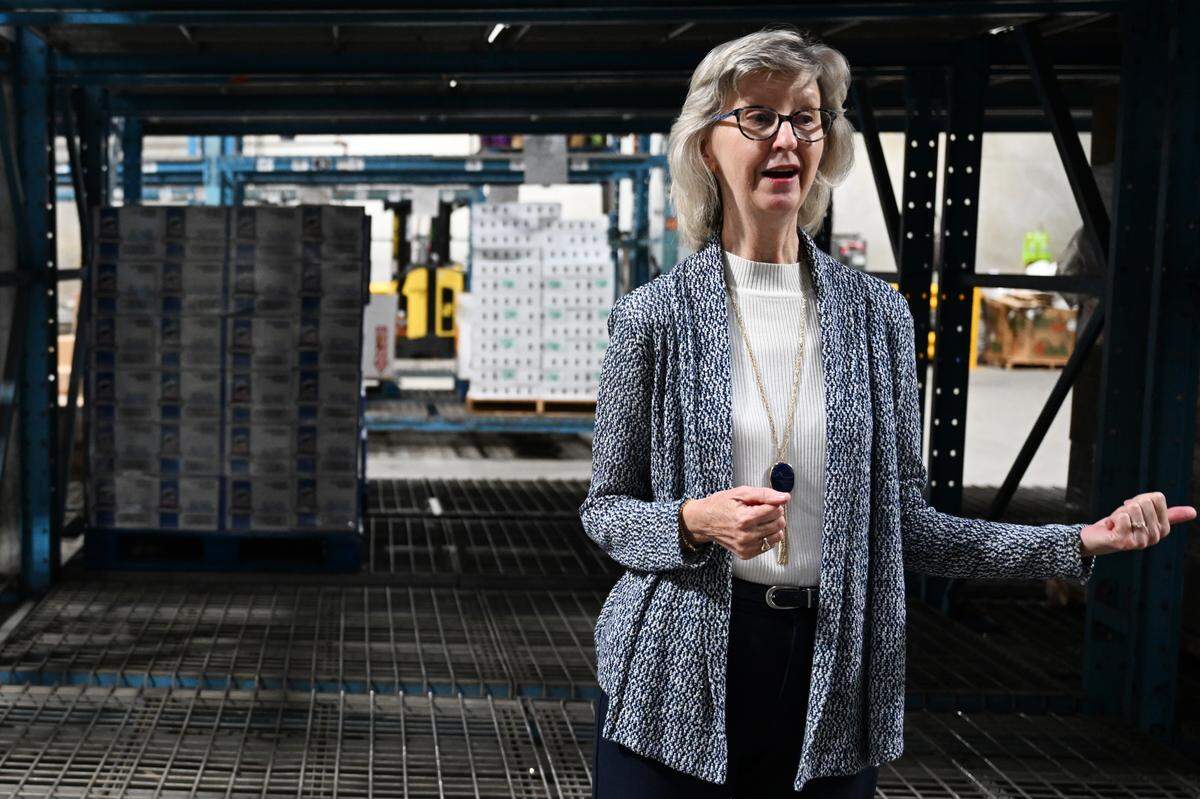 Middle Georgia Community Food Bank executive director Kathy McCollum walks past empty shelves in the food bank on Wednesday, Oct. 29, 2025, in Macon, Georgia. McCollum said that for every meal provided by a nonprofit in Georgia, another six meals are provided through SNAP benefits. 
