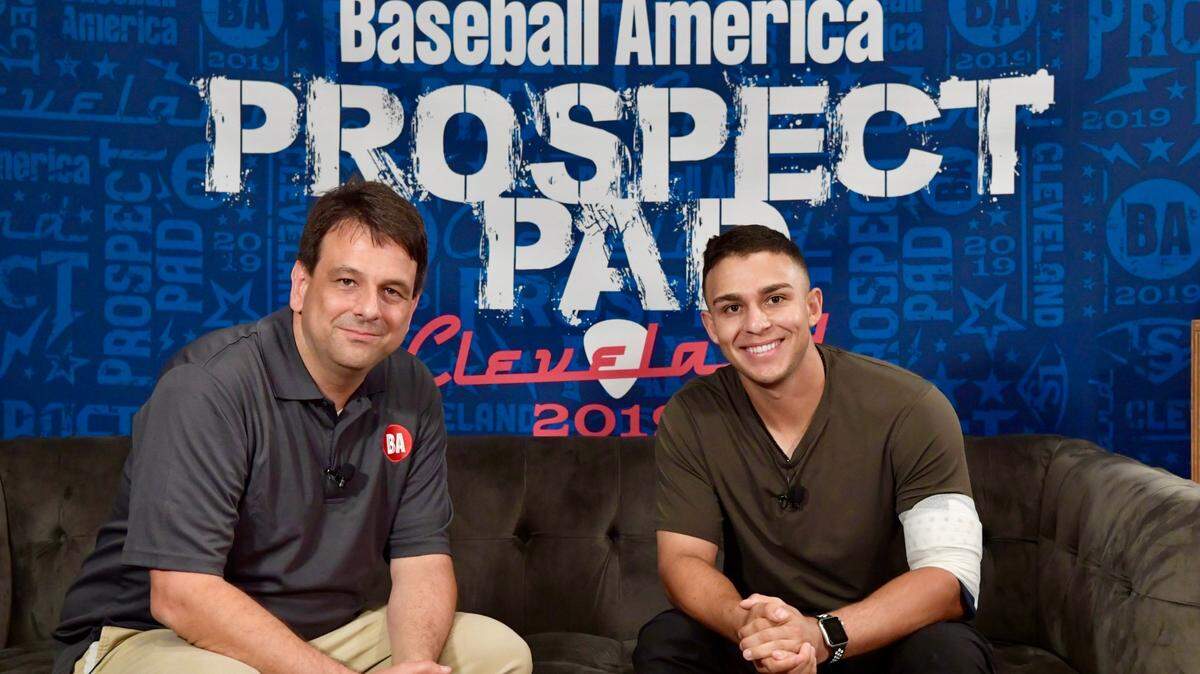 J.J. Cooper, left, executive editor of Baseball America and a native of Perry, talks with Chicago White Sox second base prospect Nick Madrigal at the Baseball America Prospect Pad in 2019.
