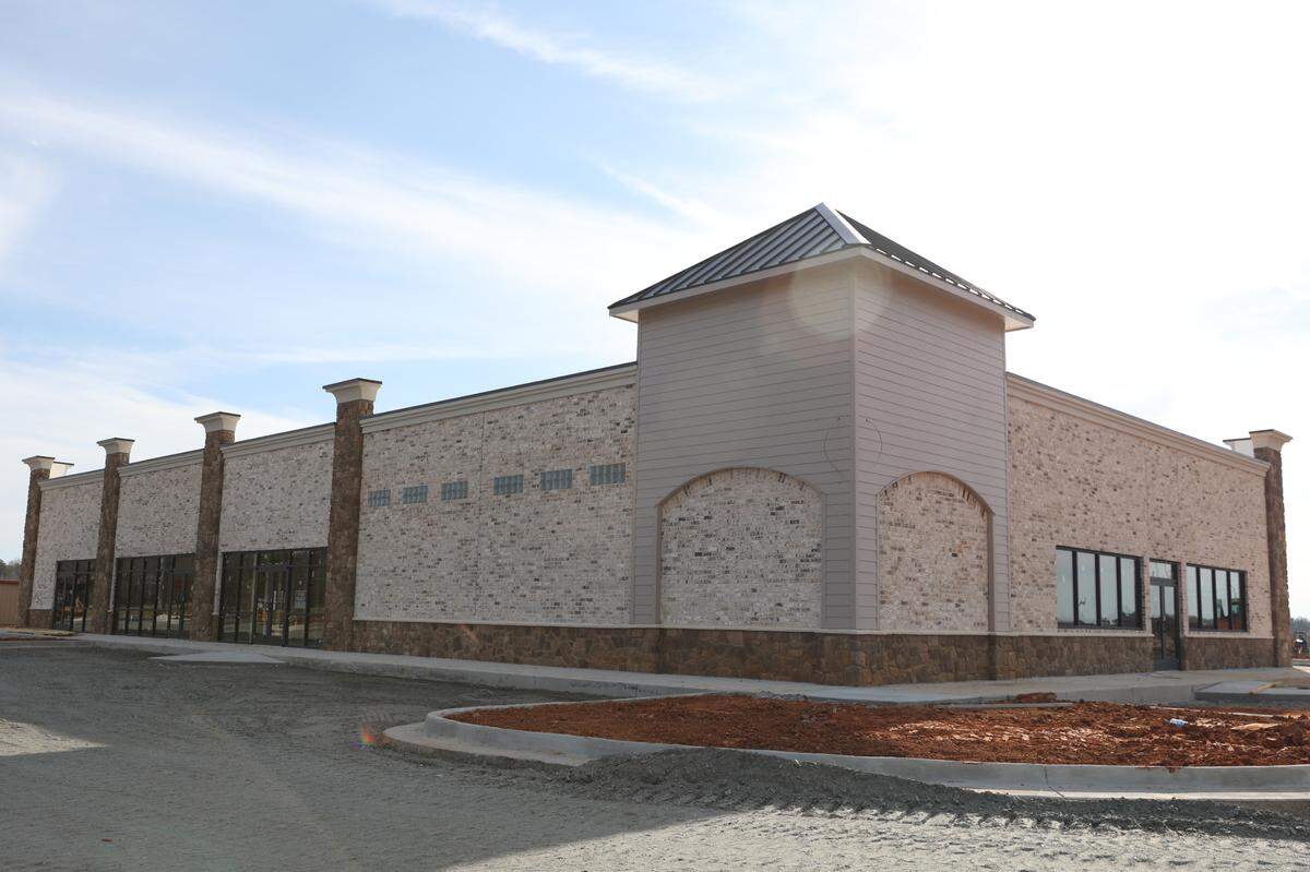 A Dunkin’ with a drive-thru and a Baskin-Robbins shop, along with a breakfast spot, are expected to open in this shopping plaza, part of the Perry Parkway Project under development at the corner of Perry Parkway and Houston Lake Road shown here on Monday, March 3, 2025, in Perry, Georgia.