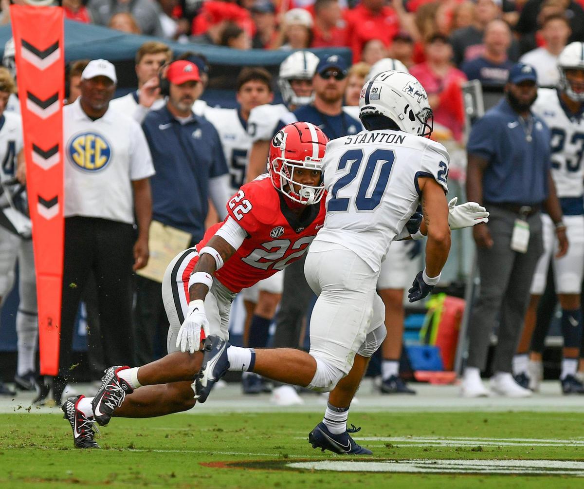 Georgia defensive back Javon Bullard (22) tackles Samford running back Jay Stanton (20) Saturday in Athens.