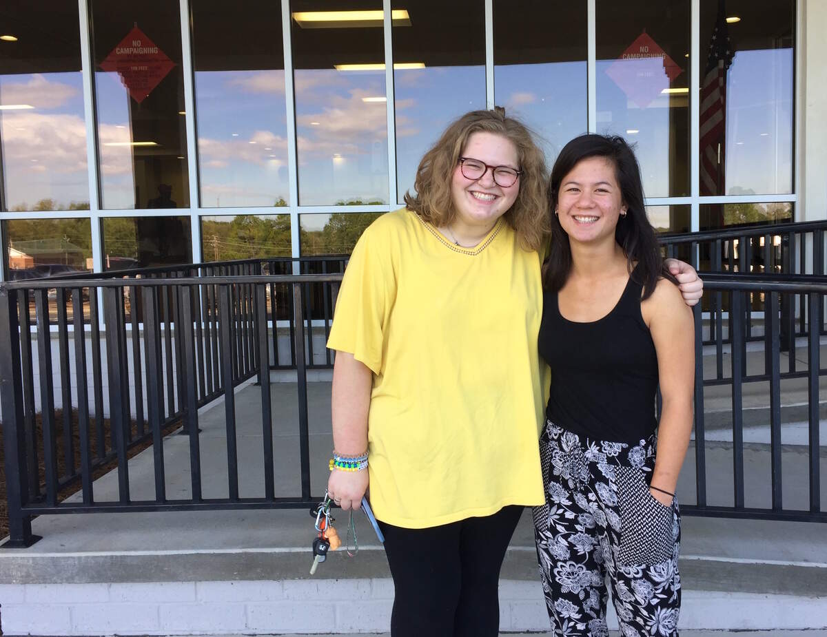 Mercer University freshmen Phoebe Capps, right, and Mellie Trager, left, vote in their first election at the Dr. Robert J. Williams Complex At Ballard Hudson in Macon. Both are 18.