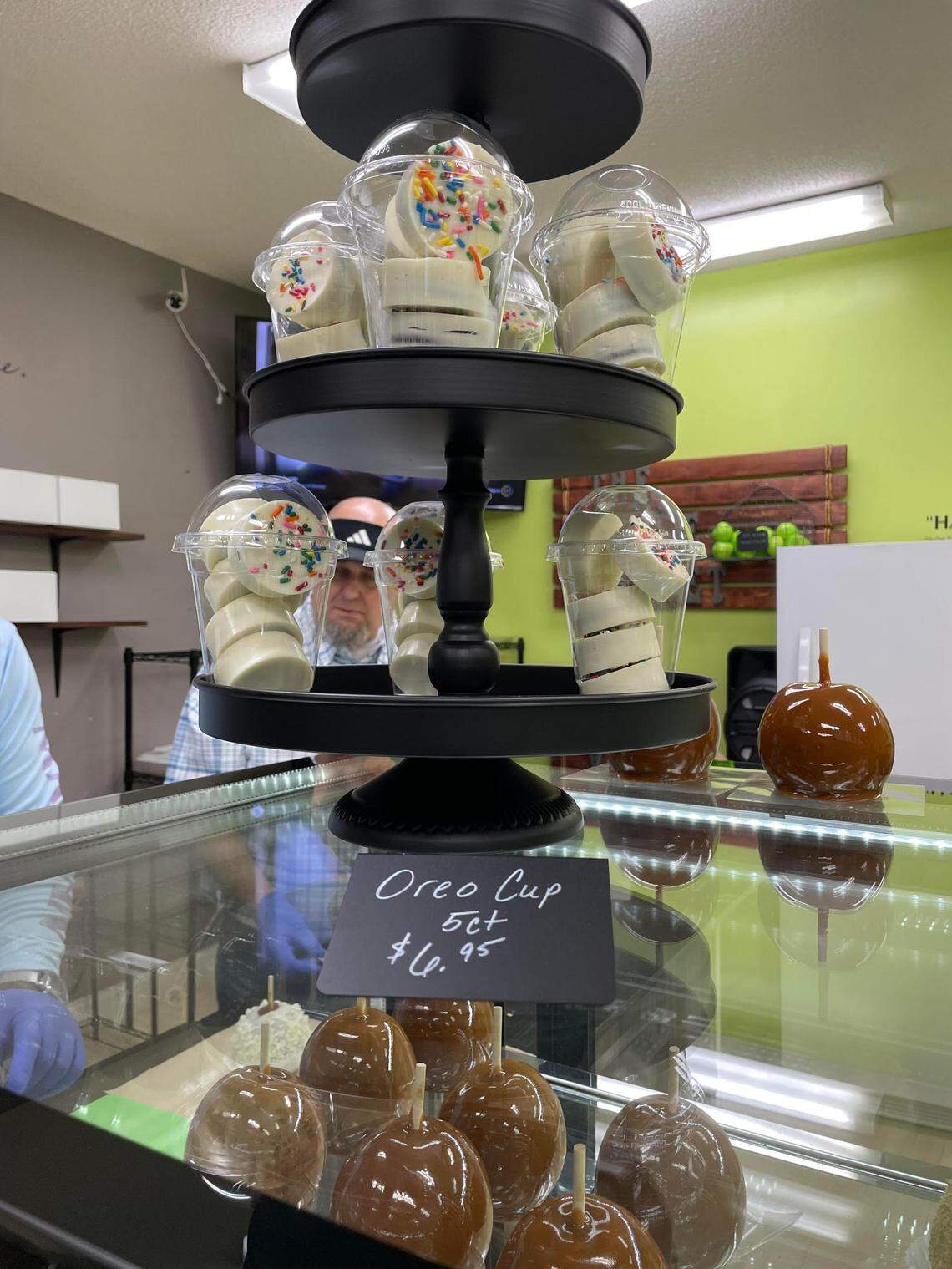 Plain caramel apples and cups of Oreos covered in white chocolate for sale at The Apple Basket in Centerville at its reopening Monday, May 5, 2025.