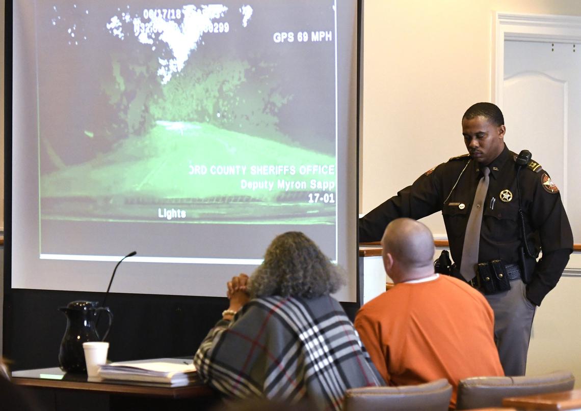 Gator Shaw and his lawyer Debra Gomez watch dashcam footage from June when Shaw stole a Crawford County sheriff deputy’s car.