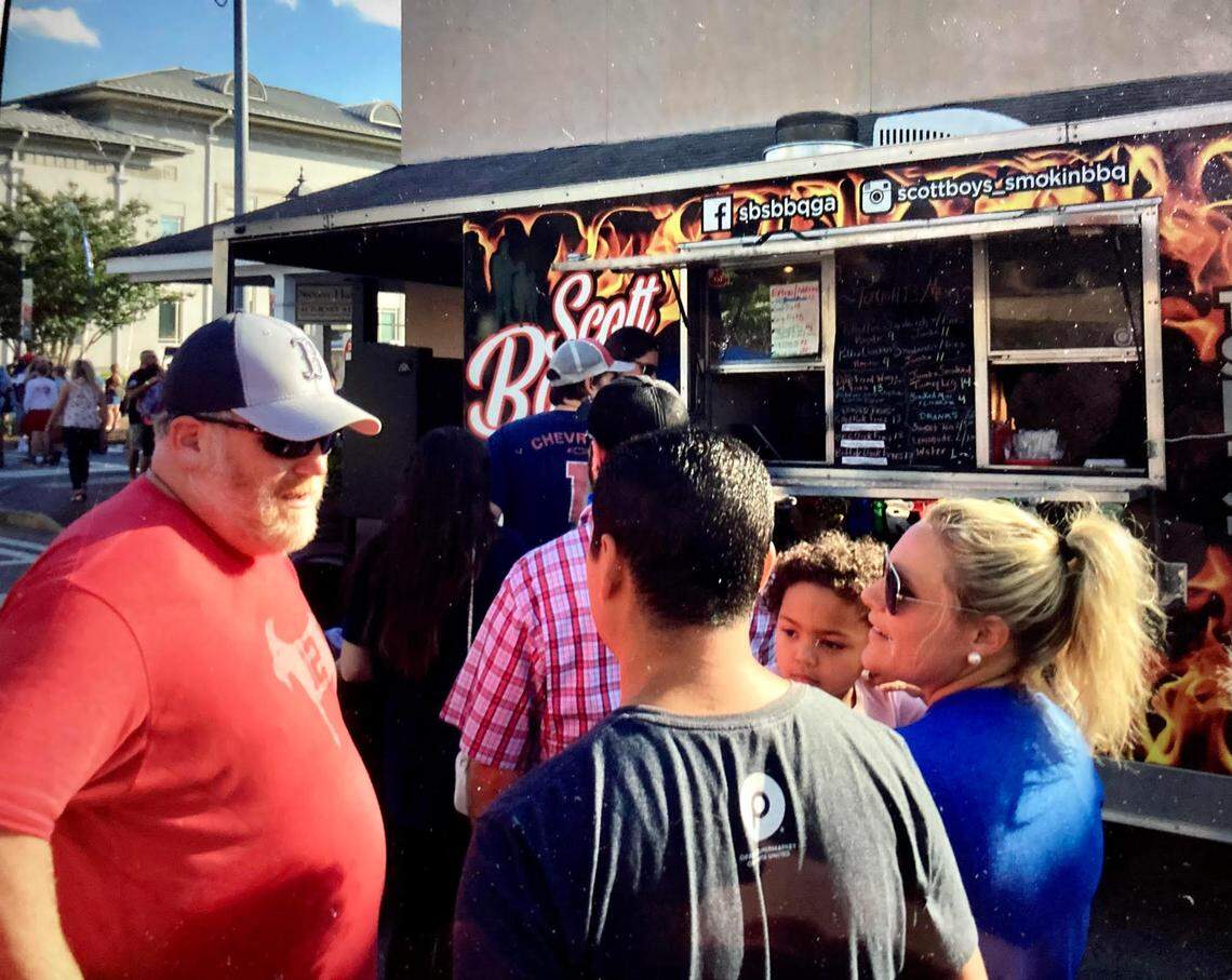 Food Truck Friday returns to downtown Perry for its fifth season. In this May 2021 Telegraph file photo, people chat in front of Scott Boys Smokin’ BBQ at a Food Truck Friday in downtown Perry.
