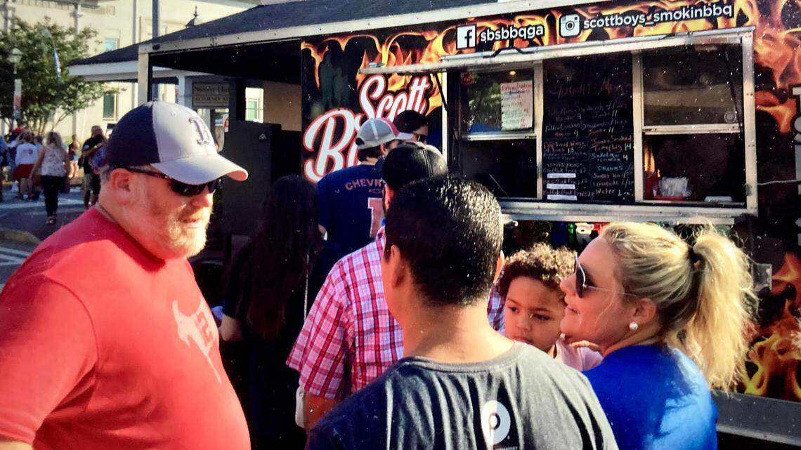 Food Truck Friday returns to downtown Perry for its fifth season. In this May 2021 Telegraph file photo, people chat in front of Scott Boys Smokin’ BBQ at a Food Truck Friday in downtown Perry.