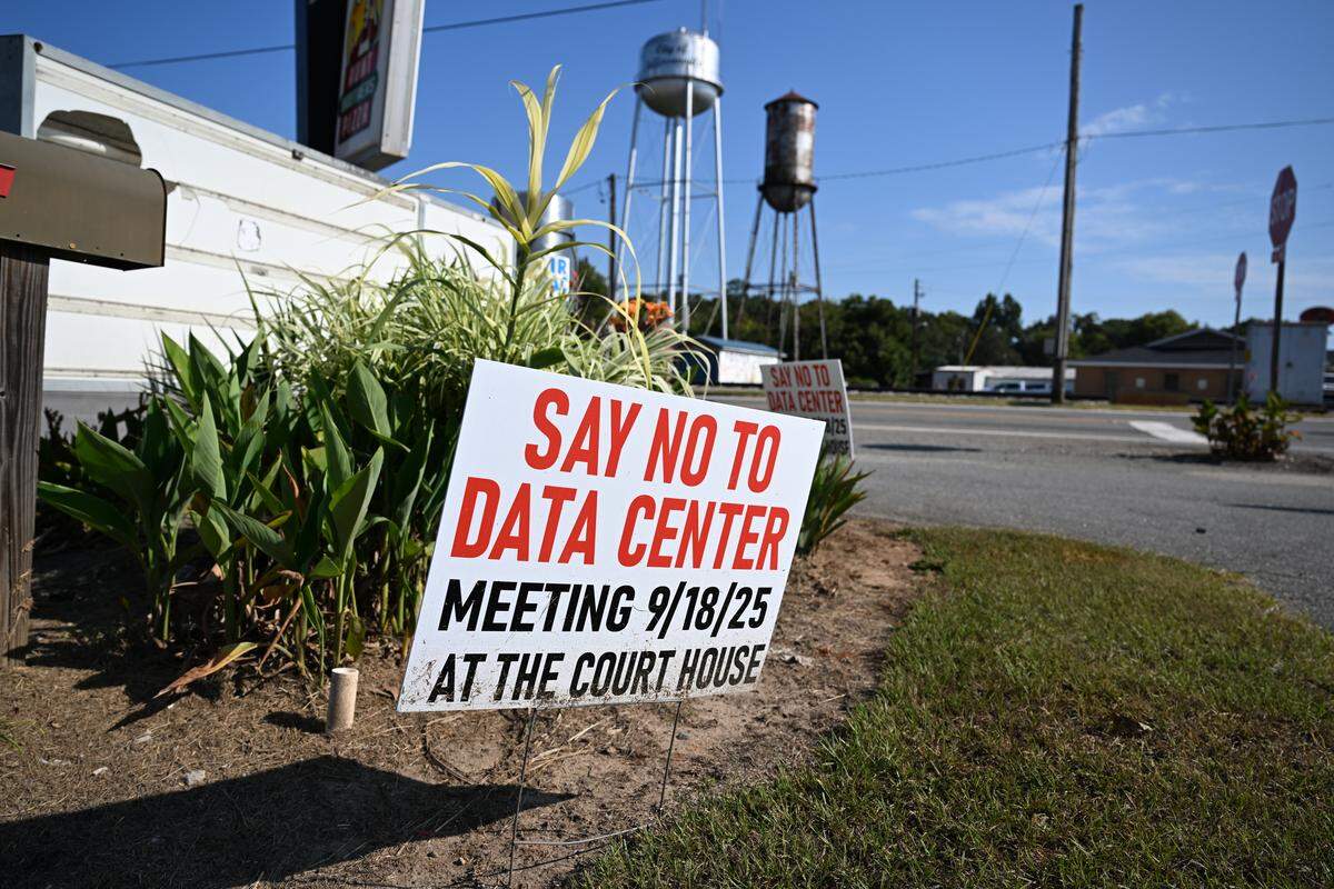 A “Say No to Data Center” sign sits off of North Railroad Street across the street from the Twiggs County Courthouse on Tuesday, Sept. 16, 2025, in Jeffersonville, Georgia. The Twiggs County Board of Commissioners is set to vote on a rezoning proposal on Thursday for a proposed data center development in the county.
