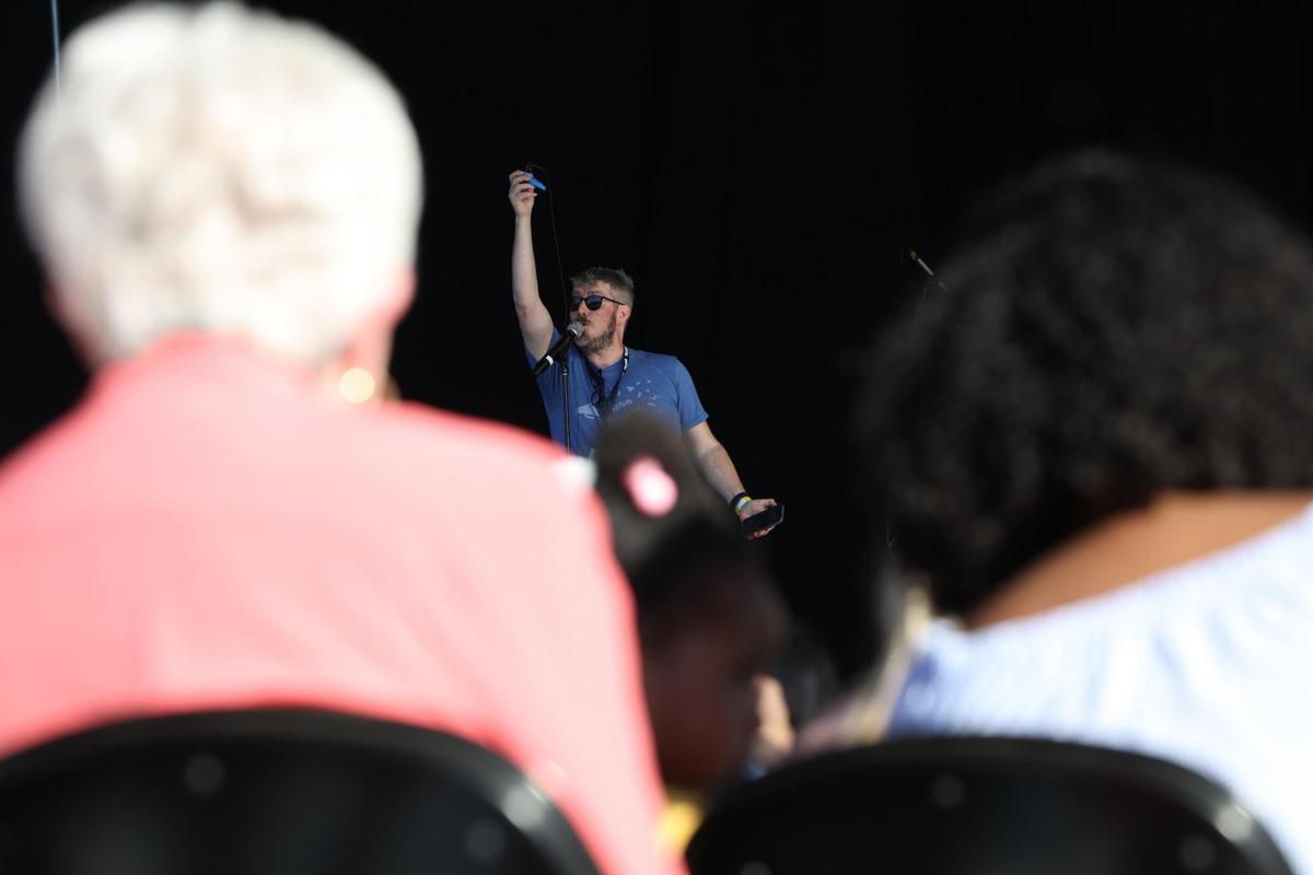 Brett Ambler, star of the viral “Kazoo Kid” meme, leads attendees in kazoo warm ups before the start of the Guinness World Record attempt for largest kazoo ensemble on Friday, March 28, 2025, at the Atrium Health Amphitheater in Macon, Georgia. Over 1,000 participants came out for the event, but their third record attempt failed to meet the mark for the record.