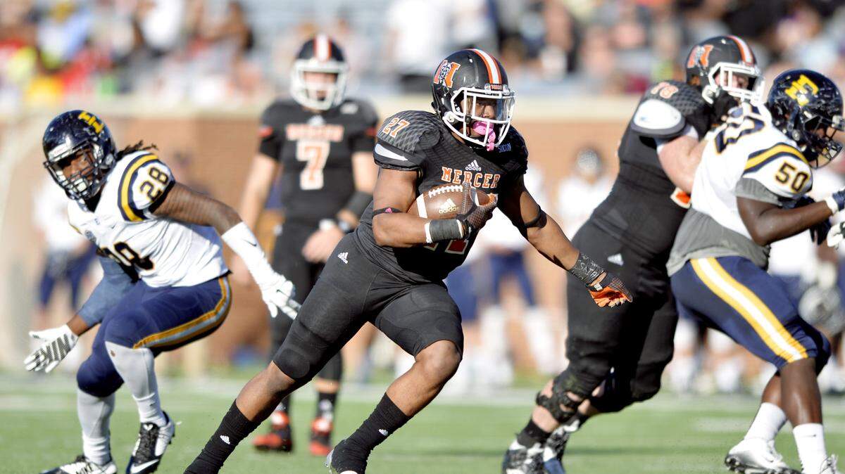 Mercer running back Alex Lakes (27) runs for a first down during their game against ETSU Saturday.