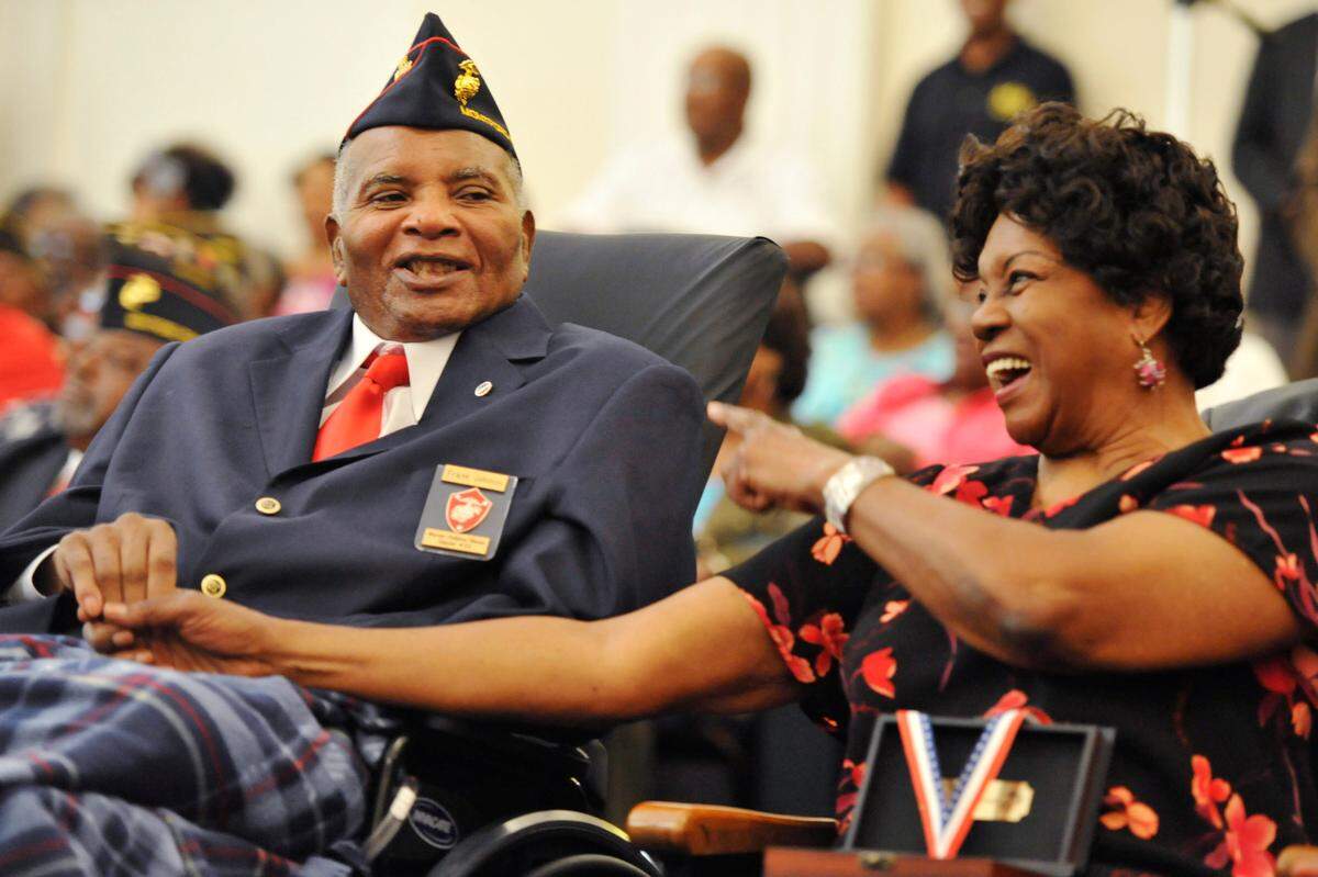 2012 file photo of Frank and Dorothy Johnson. Frank Johnson smiles, and his wife Dorothy laughs, as Macon City Council member Lonnie Miley recalls how Frank Johnson loved a party.
