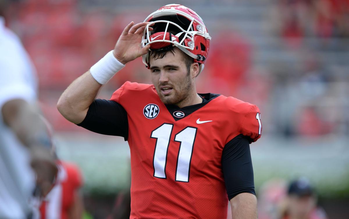 Georgia quarterback Jake Fromm tips his hat as he and the Bulldogs get ready for Tennessee.  Georgia beat Tennessee, 38-12.