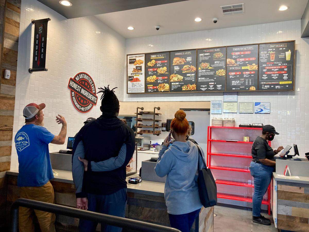 Customers order at the first Huey Magoo’s Chicken Tenders in Houston County opens at 711 Lake Joy Road in Warner Robins.