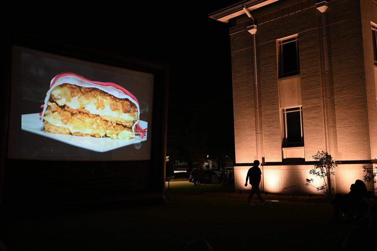 Cory Jones’ caramel apple cheesecake is shown from the side during judging of the Food Network’s “Halloween Baking Championship” during the semi-finals episode at a public watch party in downtown Perry, Monday, Oct. 20, 2025. Jones of Unadilla owns Sweet Evelyn’s in downtown Perry.
