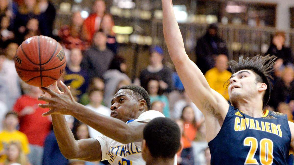 Tattnall Square's Abrien Kemp (10) and Mount de Sales' Garrett Thomson (20) battle for a rebound during their game Friday night.