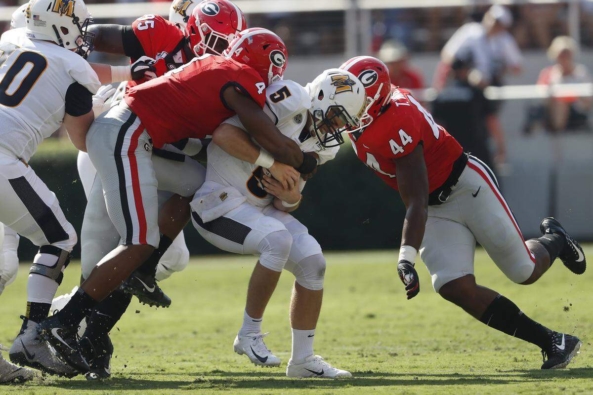 Murray State quarterback Preston Rice (5) is sacked by Georgia’s Nolan Smith (4) and Travon Walker (44) in the first half of an NCAA college football game Saturday, Sept. 7, 2019, in Athens, Ga.