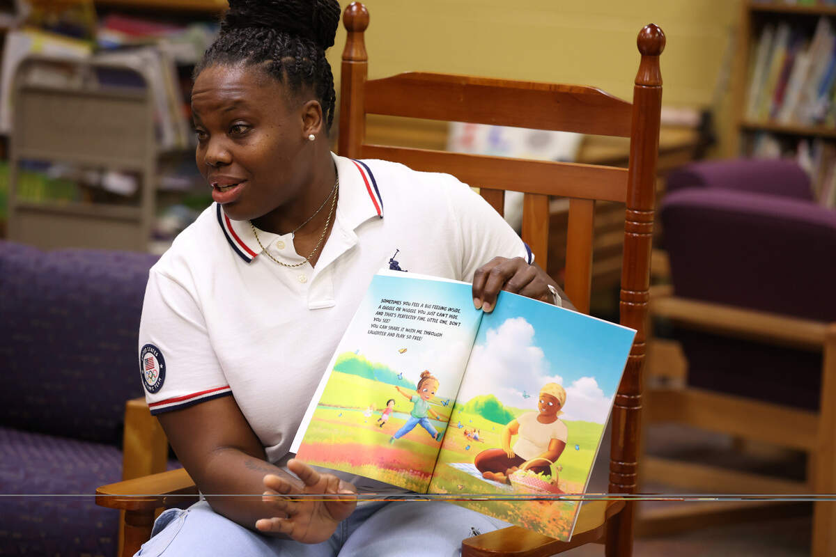 Jessica Ramsey reads her book “Feelings without Words: A Child’s Guide to Expression” to students on Friday, Jan. 9, 2026, at L.H. Williams Elementary School in Macon, Georgia. Ramsey competed in the 2021 Tokyo Olympics for Team USA in shot put and toured Bibb County schools to share her new children’s book on teaching children to express their emotions in healthy ways.