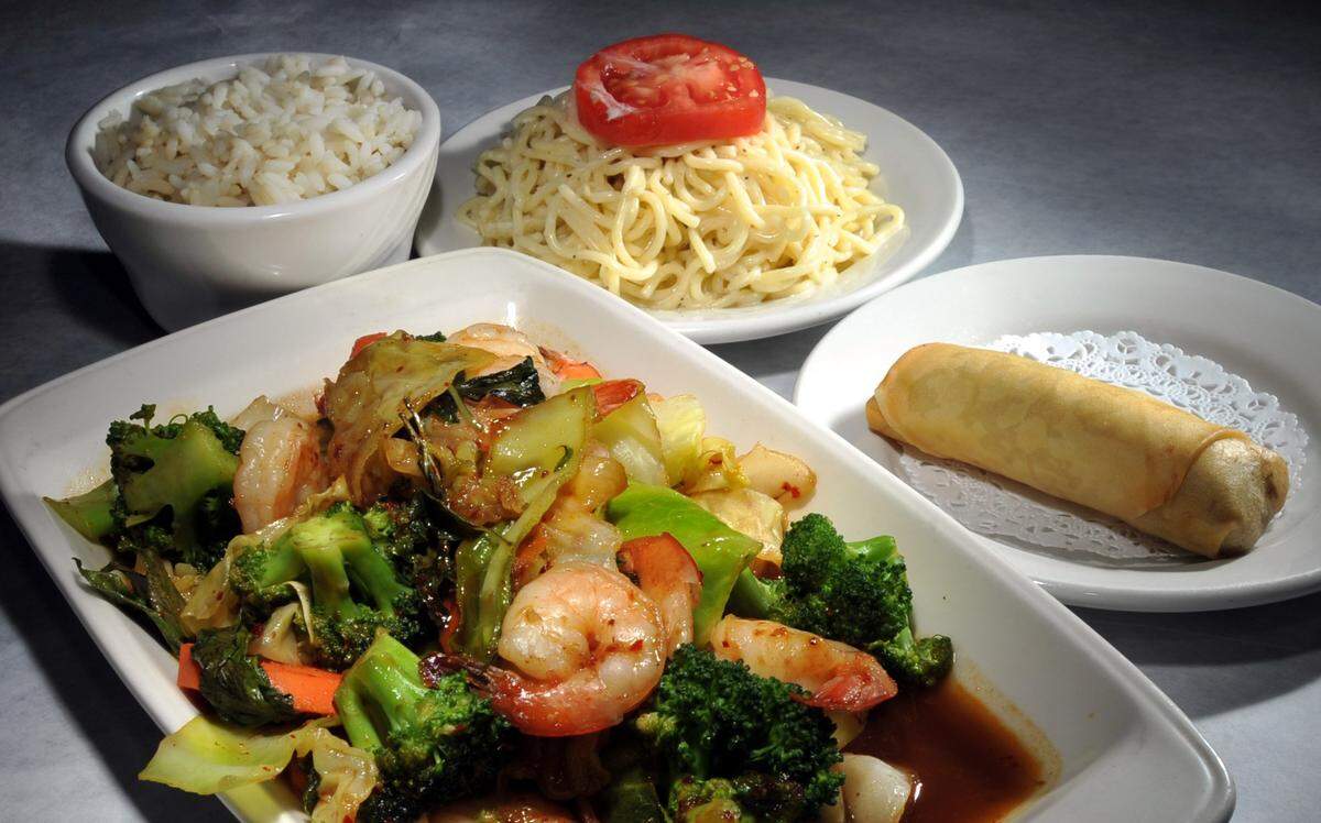 Spicy veggies with shrimp served with noodle salad, steamed rice and a vegetarian spring roll appetizer from Tokyo Alley.