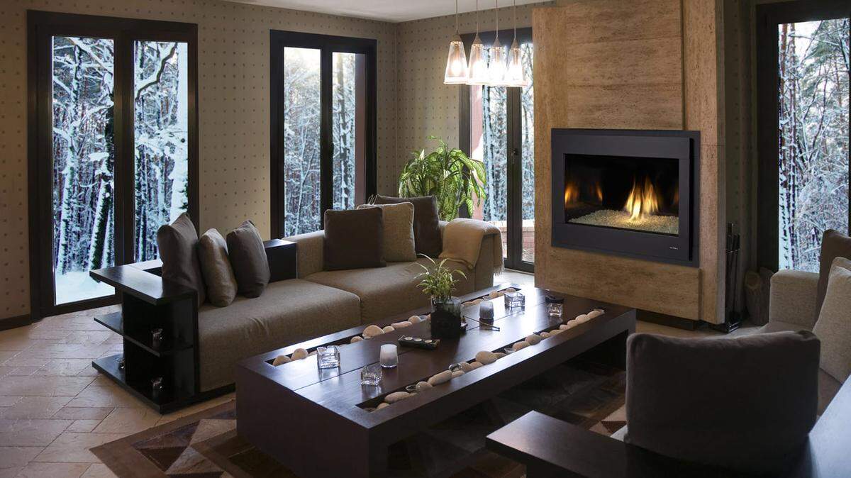 HEARTH & HOME TECHNOLOGIES 
 A black surround frames a modern fireplace. The black adds interest to the room’s decor and draws the eye toward the flames.