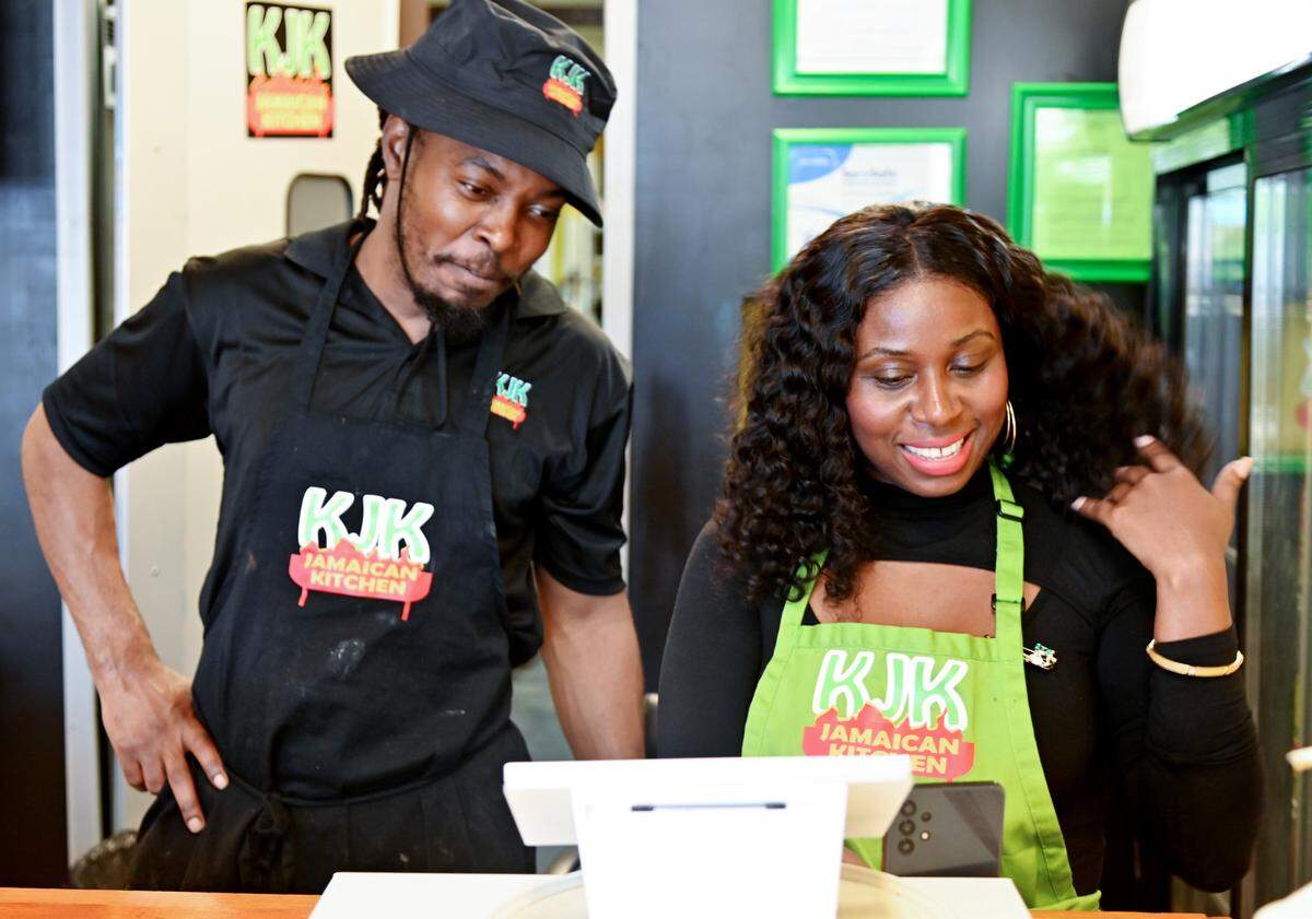 Owner and Chef Kirk Henry and cashier Emma Durogene speak on Instagram live at KJK Jamaican Kitchen located at 3348 Vineville Ave. in Macon.