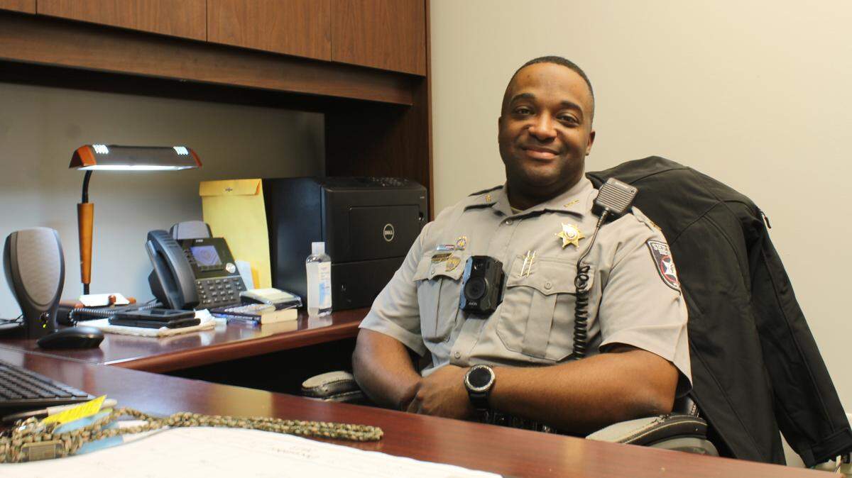 Bibb County Sheriff’s Office Sgt. Reginald Tillman, 33, sits at his desk on Friday, Nov. 15, 2024. Tillman works to cut down traffic fatalities and injuries under the Georgia Governor’s Office of Highway Safety.