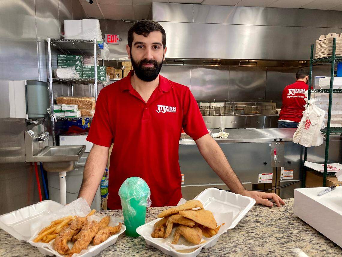 Hamza Awawdeh, left, manager at the JJ Fish & Chicken that just opened at 4351 Pio Nono Ave. in Macon. Customer favorites include the tilapia and wings combo, the chicken tenders combo and freshly squeezed lemonade.