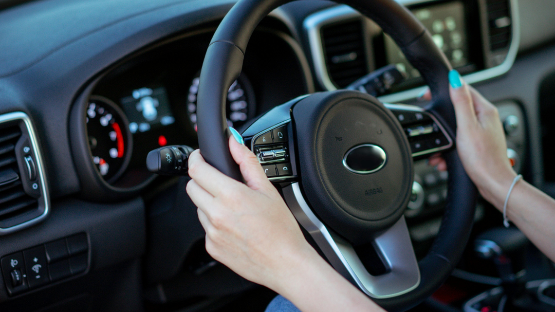 Is it legal to drive in Georgia while wearing headphones or AirPods.