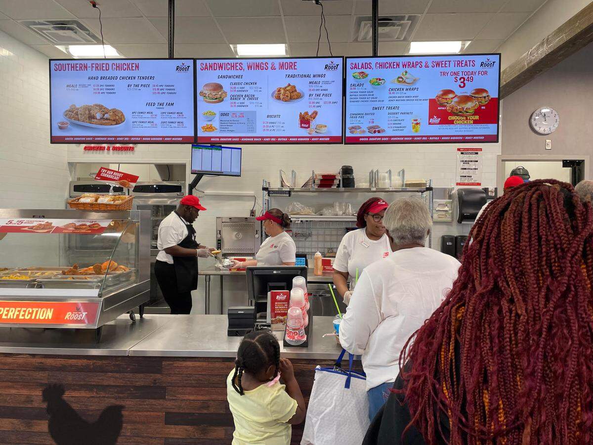 Customers line up to order at the new Raise the Roost Chicken & Biscuits inside a Speedway off the Ga. 247 Connector near Exit 146 of Interstate 75 in a portion of Warner Robins in Peach County.