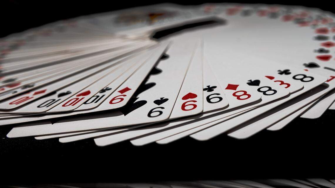 The woman was approached by a stranger who asked her to watch a game, officials said.